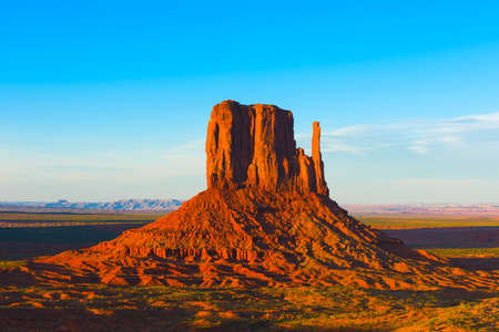 Beautiful sunset over the West Mitten Butte in Monument Valley. Utah, USAの写真素材