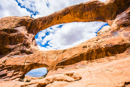Day photo of a Double O Arch. Arches National Park, Utah - USAの写真素材