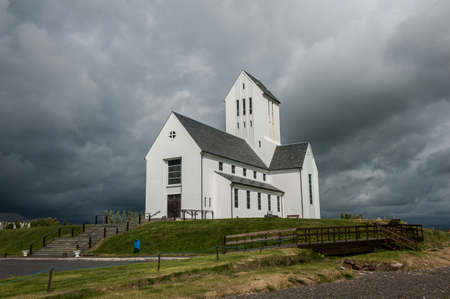 Large Icelandic cathedral in Skalholt against a overcast skyの写真素材