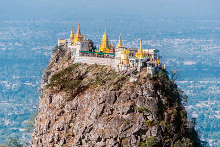 Famous buddhist temple on the summit of Taung Kalat volcano near Mt. Popa. 777 stairs have to be climbed barefoot along with monkeys to reach the top, end of pilgrimage. Myanmarの写真素材