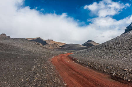 Red empty dirt road in Icelandic volcanic inland is just accesible by 4x4 vehiclesの写真素材