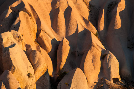 Detailed photo of vivid rock formations shaped by a morning light - seen from above in Cappadocia, Turkeyの写真素材
