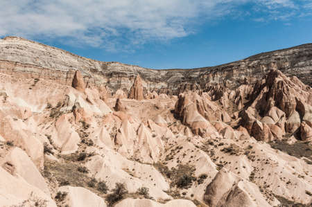 Detailed photo of vivid pink rock formations with caves from above in Cappadocia, Turkeyの写真素材
