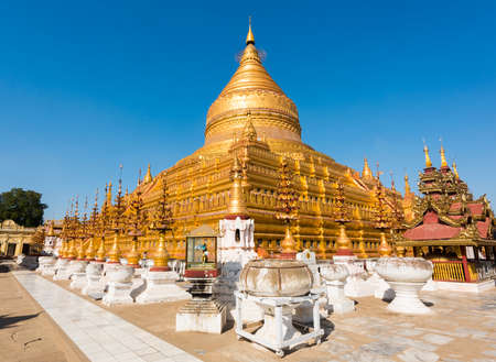 Shwezigon Pagoda is one of the oldest sacred golden buddhist pagoda in Myanmar. Town of Nyaung-U near ruins of Bagan,  Myanmarの写真素材