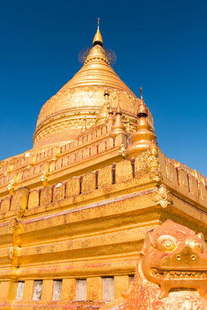 Detail of Shwezigon Pagoda which is one of the oldest sacred golden buddhist pagoda in Myanmar. Town of Nyaung-U near ruins of Bagan,  Myanmarの写真素材