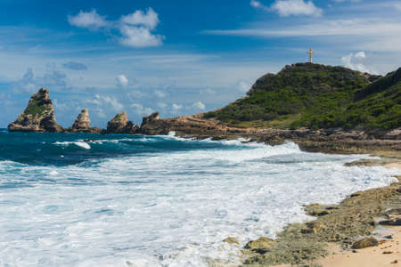 Rocks and hills  of Pointe des Chateaux, the most Eastern point of French island  of Guadeloupein the Caribbeanの写真素材