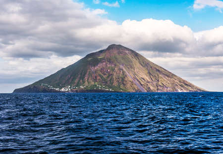 Stromboli volcano seen from the boat. Stromboli is one of the eight Aeolian islands and one of three active volcanoes in Italyの写真素材