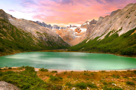 Sunset over Andes mountains and lake Laguna Esmeralda near Ushuaia in Tierra del Fuego, Argentinaの写真素材