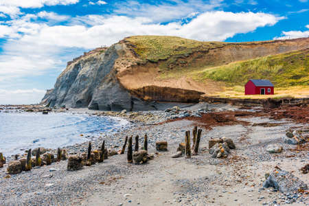 Red fisherman's cottage near the coast in the small village Cameron. Tierra del Fuego, Chileの写真素材