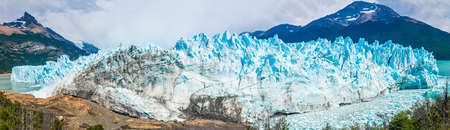 Panoramic picture of an old turquoise ice of Perito Moreno glacier. Los Glaciares national park,...