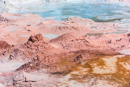 Mudpot in the geothermal area in Yelowstone National Park, Wyoming, USA. The area around the boiling...