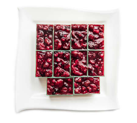 Cakes from various berries on a white plateの写真素材