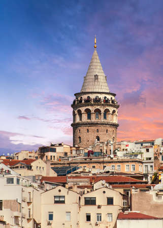 Beautiful vivid sunset over ancient Galata Tower in Istanbul, Turkeyの写真素材