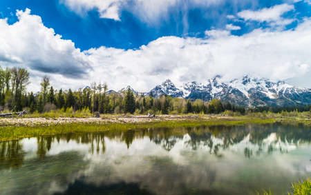 Reflection of the mountain peaks at Schwabacher landing, Grand Teton national park. Wyoming, USAの写真素材