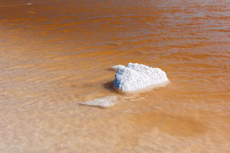 Salt lake with crystal coated stone in Tierra del Fuego in Argentina