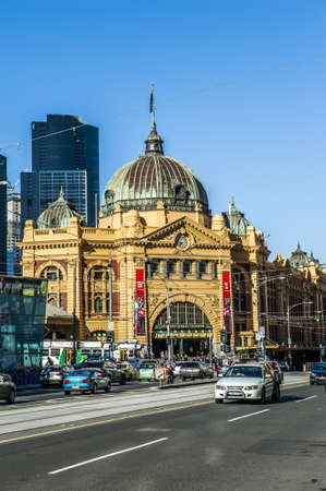 MELBOURNE, AUSTRALIA - OCTOBER 14, 2013: Heavy traffic in the morning in front of the Flinders Street Station. The building which is the biggest railway station in Melbourne was completed in 1909. Victoria, Australiaのeditorial素材