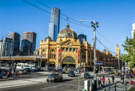 MELBOURNE, AUSTRALIA - OCTOBER 14, 2013: Heavy traffic in the morning in front of the Flinders Street Station. The building which is the biggest railway station in Melbourne was completed in 1909. Victoria, Australiaのeditorial素材