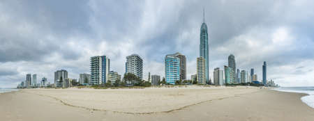 GOLD COAST, QUEENSLAND, AUSTRALIA - OCTOBER 26, 2013: Skyscrapers and hotels of Gold Coast city with a Surfers Paradise beach. Queensland, Australia. Panoramic photoのeditorial素材