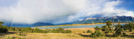 Panoramic photo of rainbow over Roca Lake (Lago Roca) and Andes mountains in Los Glaciares National...