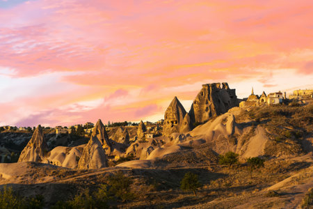 Caves near ancient town and a castle of Uchisar dug from a mountains after sunrise, Cappadocia, Turkey.の写真素材