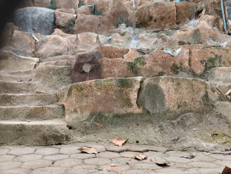 Old stone wall made of stone and cement, background photo textureの写真素材