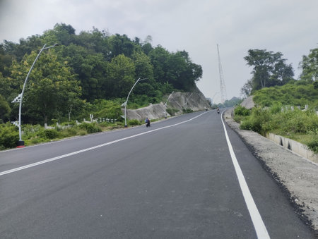 Serene Asphalt Road with sky backgroundの写真素材