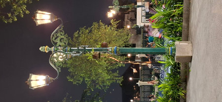Photo of antique garden lights at night.