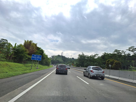 View of the toll road crowds during the Christmas and New Year holidays, Trans Java Toll Road (Jalan Tol Trans Jawa, Semarang - Bawen) in Central Java, Indonesia.の写真素材