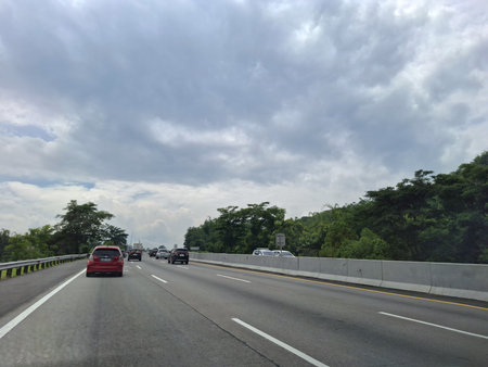 View of the toll road crowds during the Christmas and New Year holidays, Trans Java Toll Road (Jalan Tol Trans Jawa, Semarang - Bawen) in Central Java, Indonesia.の写真素材
