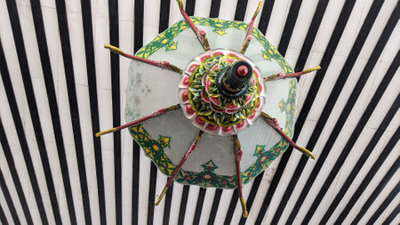 Decorated umbrella on the roof of a building in Indonesia .の写真素材
