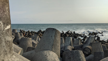 A collection of cast concrete breakwaters at Glagah Kulon Progo beach, Yogyakarta.の写真素材
