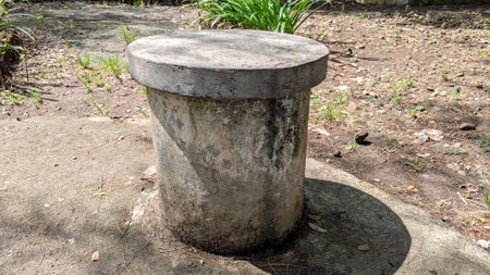 Round concrete bollard in the park, closeup of photoの写真素材