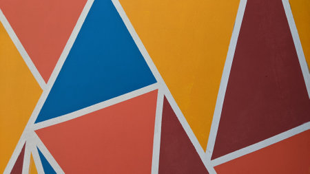 Colorful geometric pattern on a wall. Abstract background and texture for design.の写真素材
