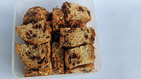 Clear plastic containers are filled with sliced â€‹â€‹Country Bread Sour dough bread....