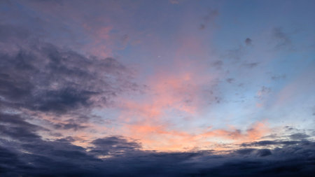 A breathtaking twilight sky painted with soft hues of purple, pink, and orange. Wispy clouds drift...