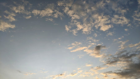 A breathtaking twilight sky painted with soft hues of blue and pink. Wispy clouds drift across the...