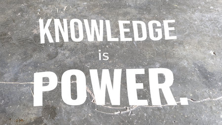 A motivational quote on a textured gray background. The bold white text reads, "KNOWLEDGE is POWER." The words are large, with "is" being the only word in lowercase.の写真素材