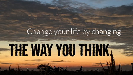 A motivational quote against a blurry sunrise landscape with tall grass and a dark foreground. The...