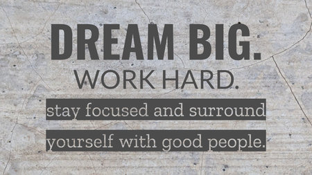 A powerful motivational quote is laid over a textured, cracked concrete background. The bold text reads &quot;Dream Big. Work Hard. stay focused and surround yourself with good people.&quot;の写真素材