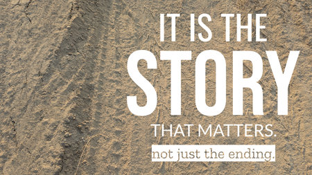 A quote, &quot;IT IS THE STORY THAT MATTERS. not just the ending,&quot; is shown on a textured dirt surface. The ground is a mix of fine dust and small clumps, with a darker track on the left.の写真素材