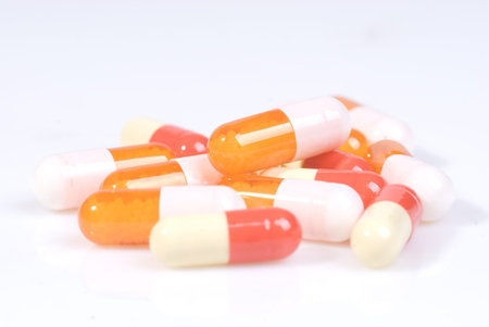 closeup of medical capsules isolated on white background