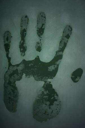 hand print on blackboardの写真素材