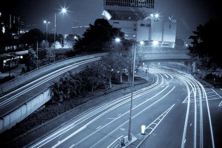 moving car with blur light through city at nightのeditorial素材