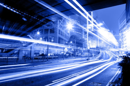 moving car with blur light through city at nightのeditorial素材