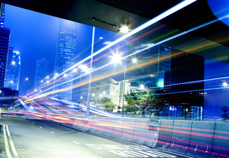 moving car with blur light through city at night 