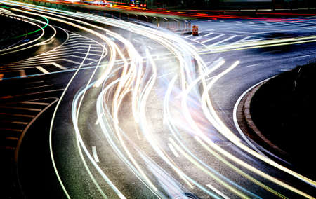 moving car with blur light through city at nightの写真素材