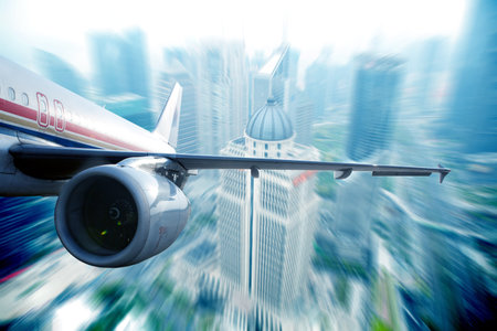 the airplane away from the city,abstract backgroundの写真素材