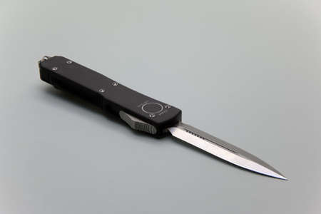 Automatic out the front knife isolated の写真素材