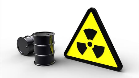 Triangle radioactive hazard sign next to black barrelsの写真素材