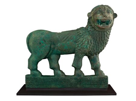 Old lion stone sculpture isolated on whiteの写真素材